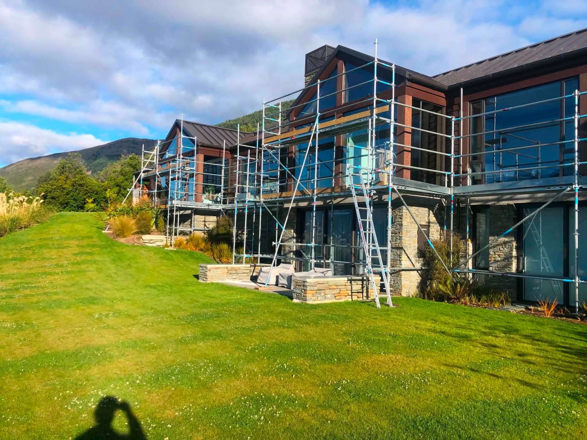 Alpine home fully scaffolded for a complete exterior repaint