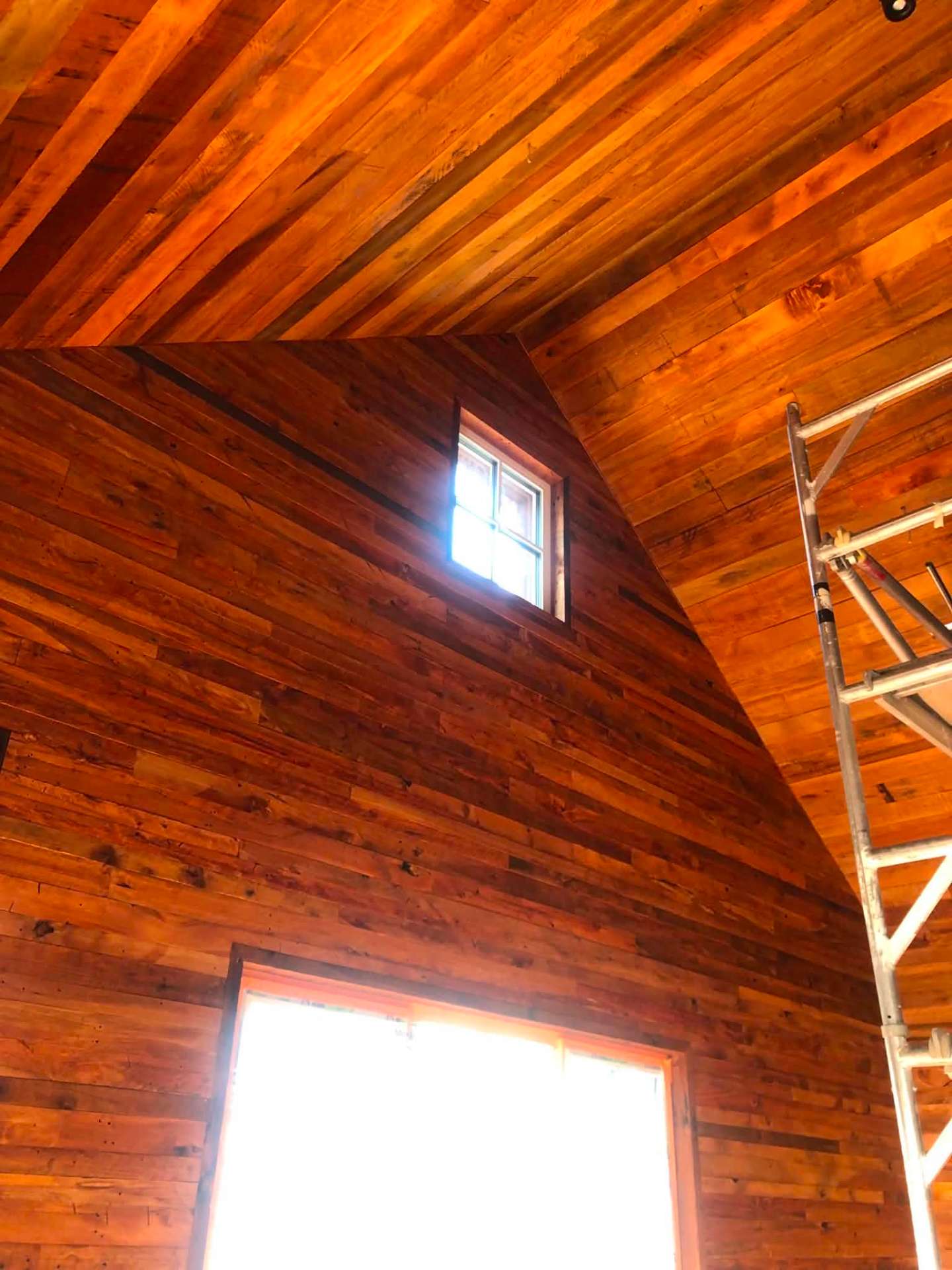 Interior cedar-lined vaulted ceiling and walls freshly stained